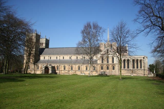 Worksop Priory seen across the green