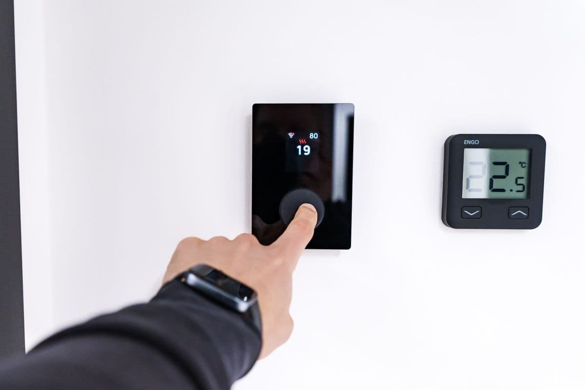 Smart heating thermostat on a wall