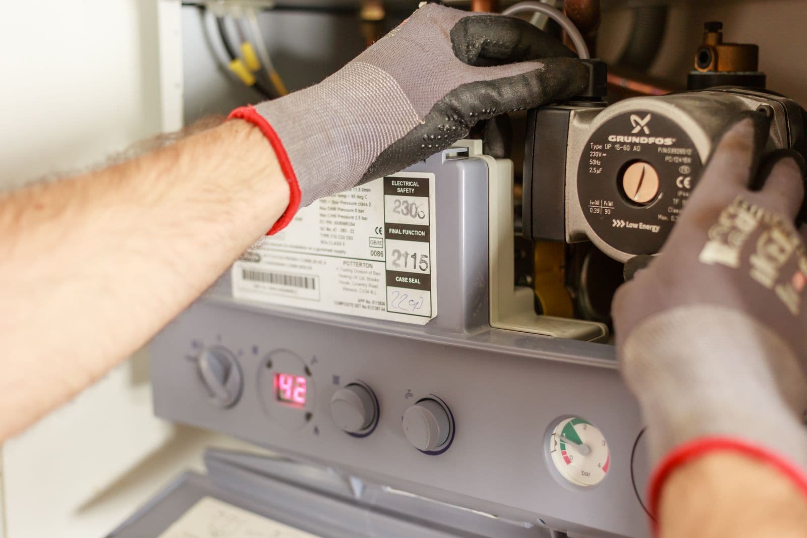 Engineer servicing a gas boiler